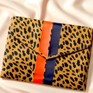 Stella & Dot Animal Print Clutch. Striped interior has 8 credits cards slots.